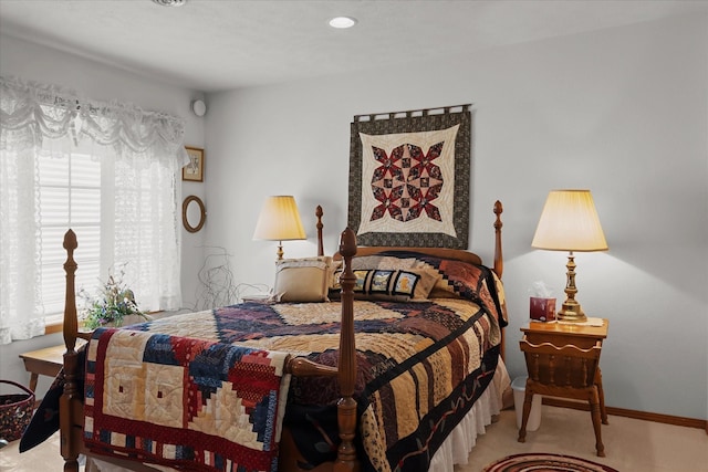 bedroom featuring light carpet