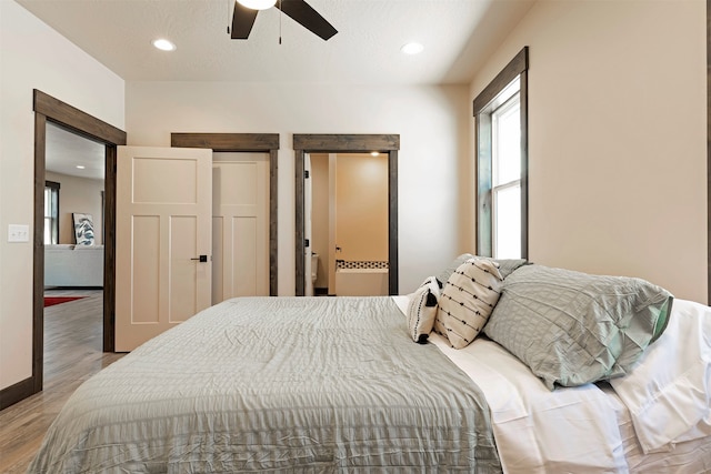 bedroom featuring light hardwood / wood-style flooring and ceiling fan