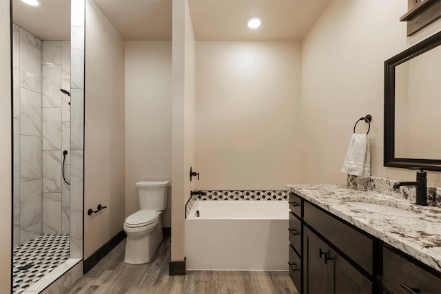 full bathroom with vanity, plus walk in shower, wood-type flooring, and toilet