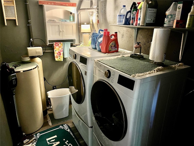 clothes washing area featuring washer and dryer