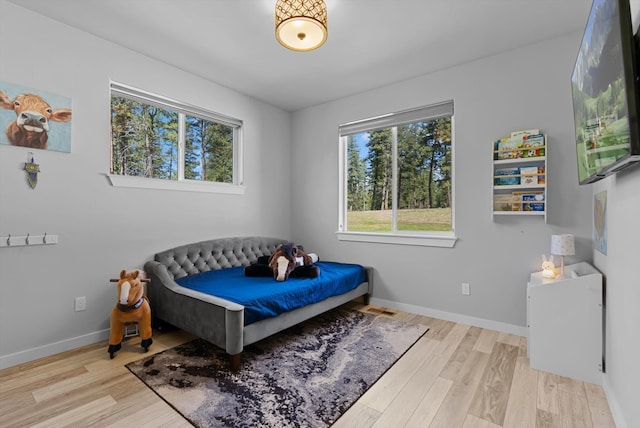 bedroom featuring light wood-type flooring