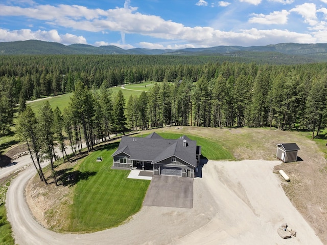 bird's eye view featuring a mountain view and a view of trees