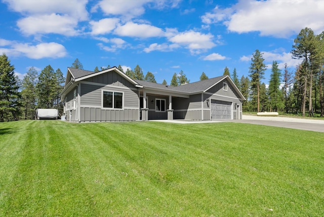 view of front of property with a garage and a front yard