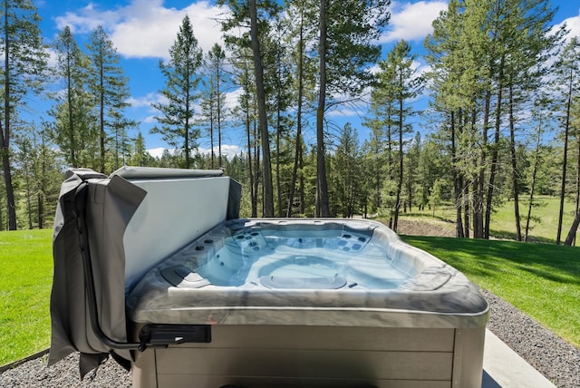 exterior space with a hot tub