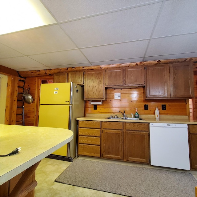 15426 Steamboat Dr, Augusta, MT 59410 - kitchen with light countertops, freestanding refrigerator, a drop ceiling, a sink, and dishwasher