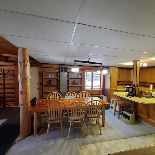 15426 Steamboat Dr, Augusta, MT 59410 - dining room with log walls and a paneled ceiling