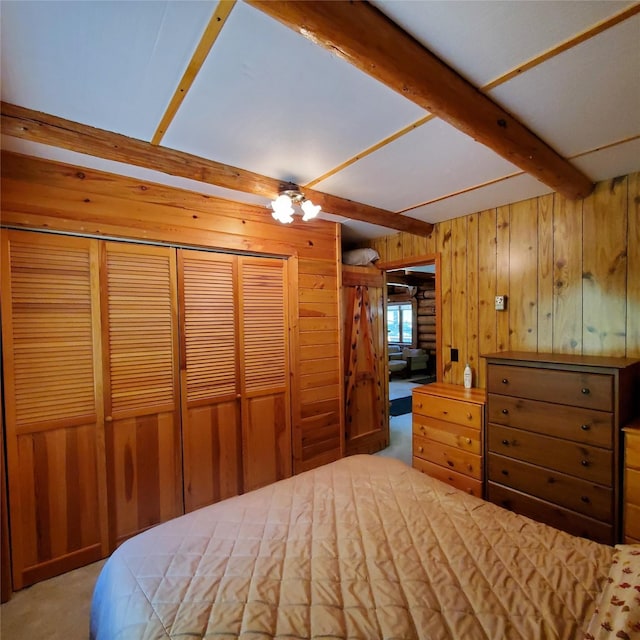 15426 Steamboat Dr, Augusta, MT 59410 - bedroom with beamed ceiling, a closet, wood walls, and carpet flooring