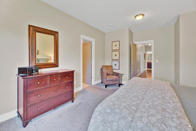 bedroom with light carpet