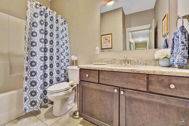 full bathroom featuring tile patterned floors, vanity, toilet, and shower / tub combo with curtain