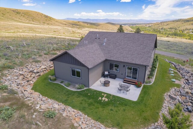 birds eye view of property with a mountain view