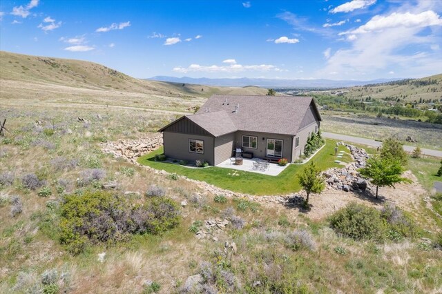 birds eye view of property with a mountain view