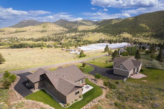 birds eye view of property with a mountain view