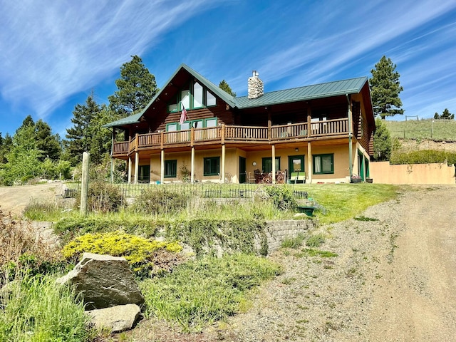 rear view of property with a deck