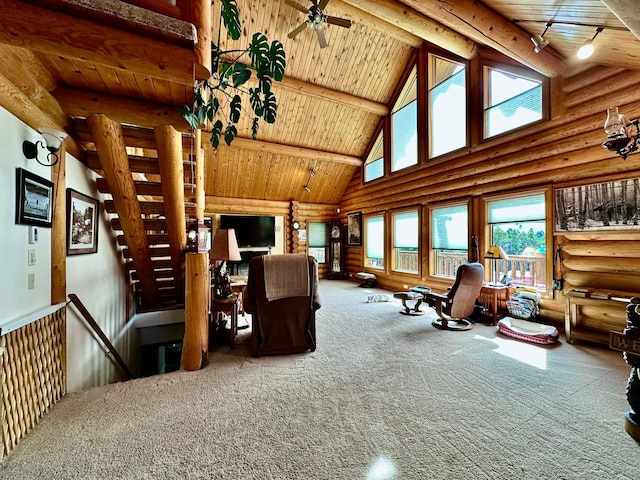 carpeted living room with wood ceiling, ceiling fan, log walls, beam ceiling, and high vaulted ceiling