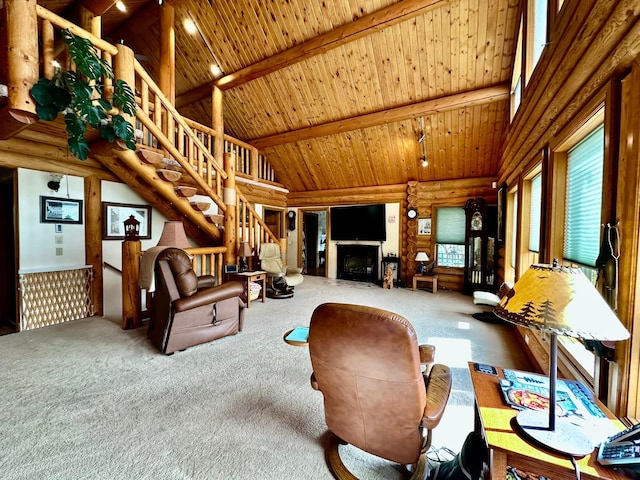 living room with carpet flooring, wood ceiling, log walls, beam ceiling, and high vaulted ceiling