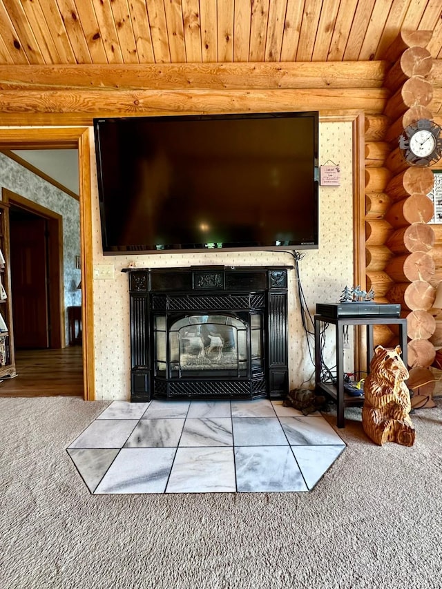 details featuring wooden ceiling, log walls, and a tiled fireplace