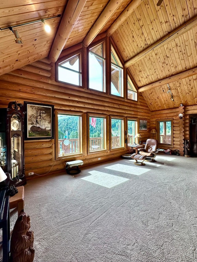 unfurnished living room with log walls, high vaulted ceiling, beamed ceiling, and wood ceiling