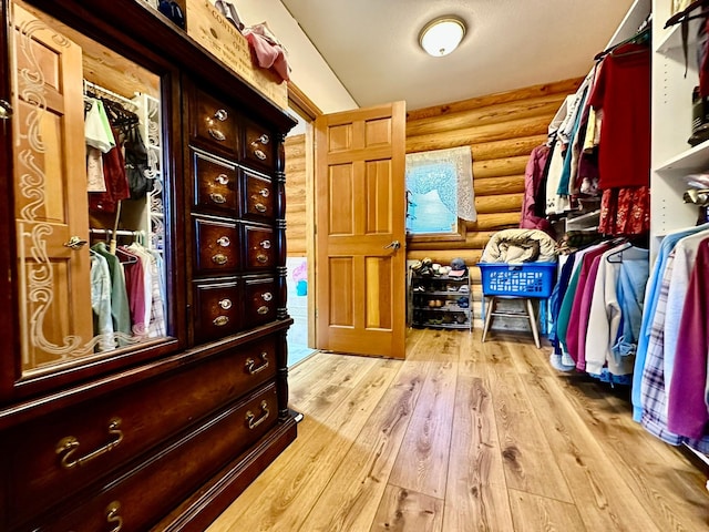 walk in closet featuring light wood-type flooring