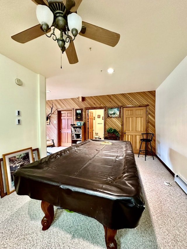 playroom featuring carpet flooring, wood walls, ceiling fan, and pool table