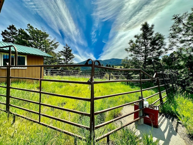 view of gate with a mountain view