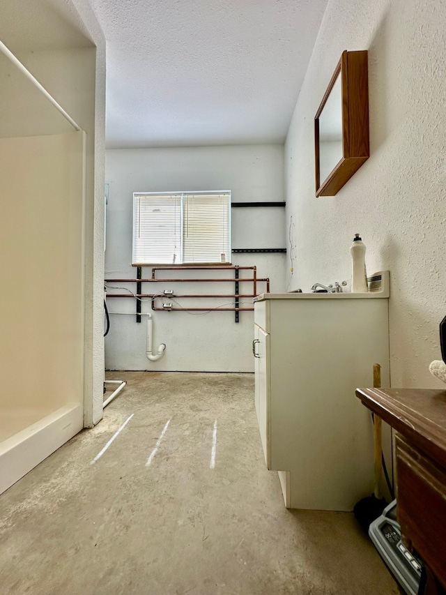 bathroom featuring concrete flooring