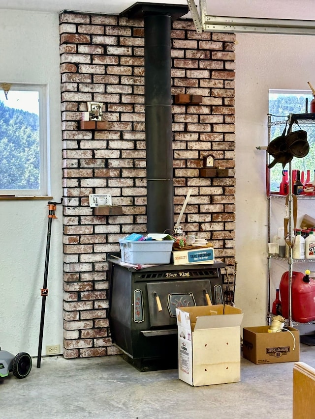 interior details with a wood stove and concrete flooring