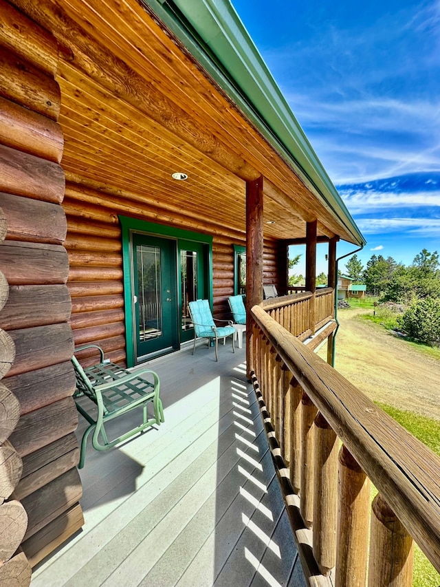 wooden terrace with a porch