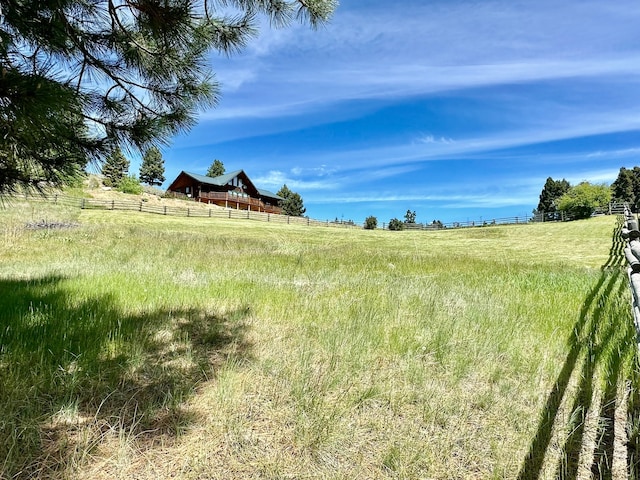 view of yard with a rural view