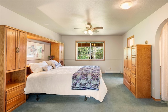 bedroom featuring carpet flooring, baseboard heating, and ceiling fan