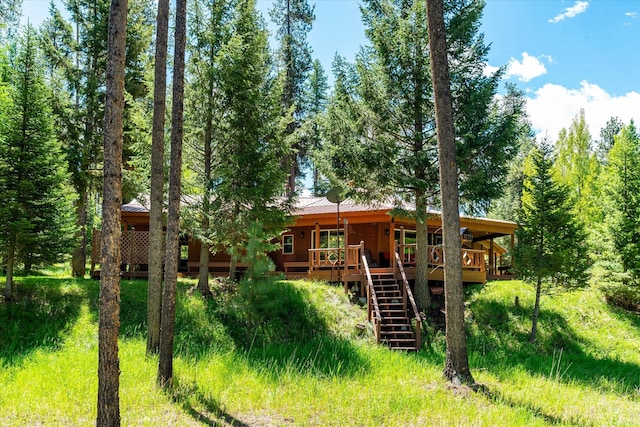 rear view of house with a wooden deck