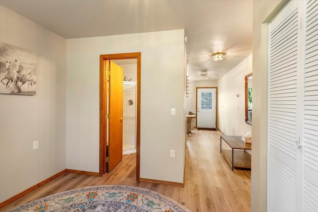 hall with light wood-type flooring