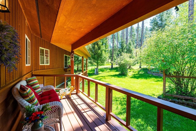 wooden terrace with a yard