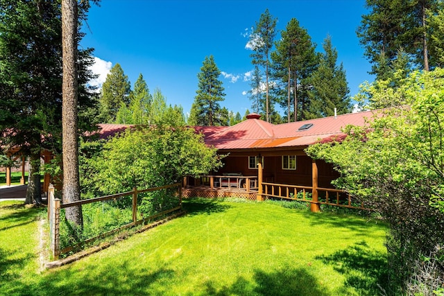 view of yard featuring a wooden deck