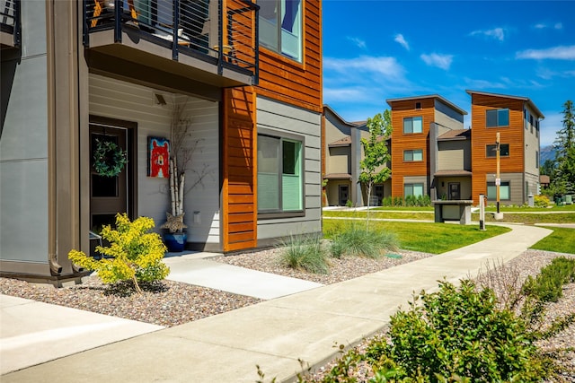 281 Blackberry Loop Unit A, Whitefish, MT 59937 - entrance to property with a balcony, a lawn, and a residential view