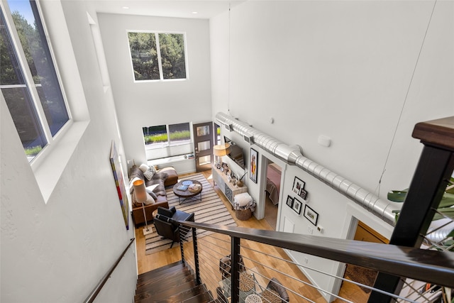281 Blackberry Loop Unit A, Whitefish, MT 59937 - stairs with wood-type flooring, a high ceiling, and recessed lighting