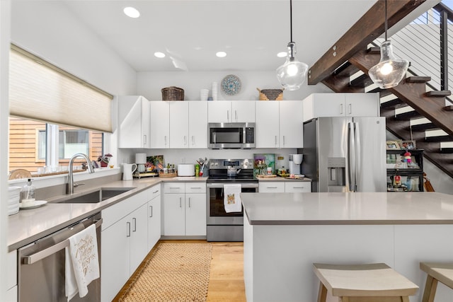281 Blackberry Loop Unit A, Whitefish, MT 59937 - kitchen featuring stainless steel appliances, a sink, healthy amount of natural light, pendant lighting, and recessed lighting