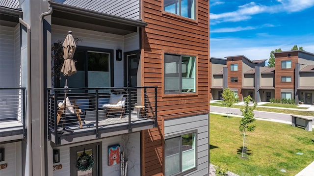 281 Blackberry Loop Unit A, Whitefish, MT 59937 - view of home's exterior featuring a balcony, a yard, and a residential view