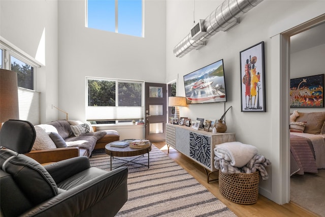 281 Blackberry Loop Unit A, Whitefish, MT 59937 - living room featuring light wood-style flooring and a towering ceiling