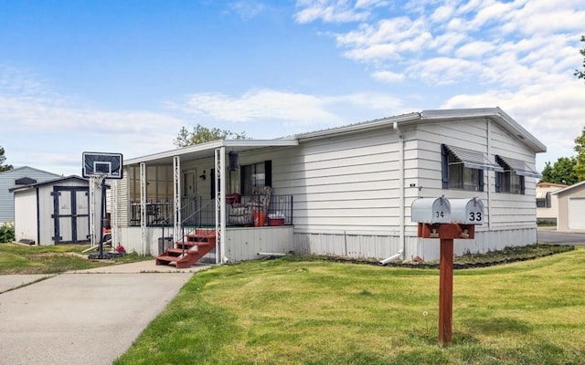 manufactured / mobile home with a garage and a front yard