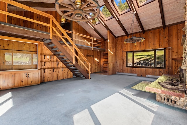 miscellaneous room featuring a baseboard heating unit, wooden walls, high vaulted ceiling, and wooden ceiling