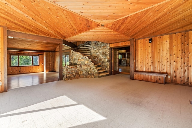 unfurnished room featuring wooden ceiling, wood walls, and tile floors