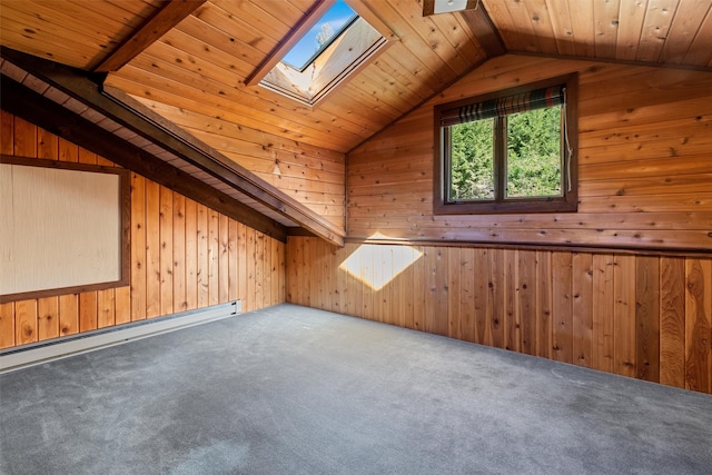 interior space with wood ceiling, baseboard heating, lofted ceiling with skylight, and wood walls