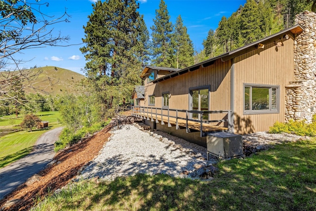 exterior space with a yard and a mountain view