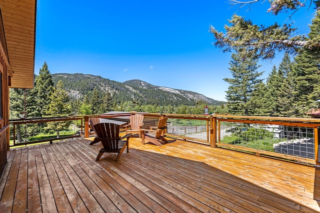 wooden terrace with a mountain view