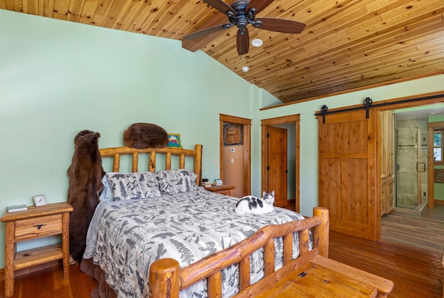 bedroom with wooden ceiling, a barn door, vaulted ceiling, and wood finished floors