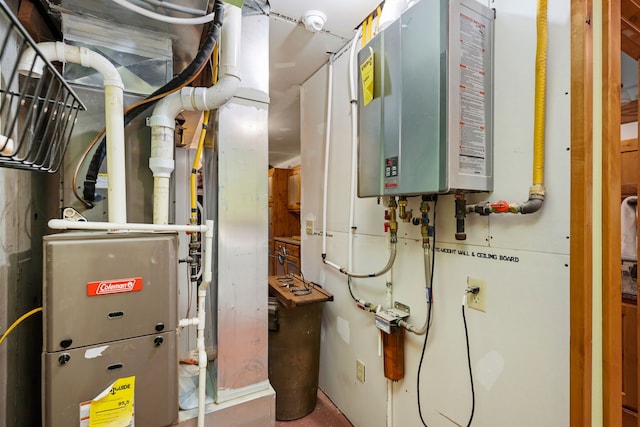 utility room featuring water heater