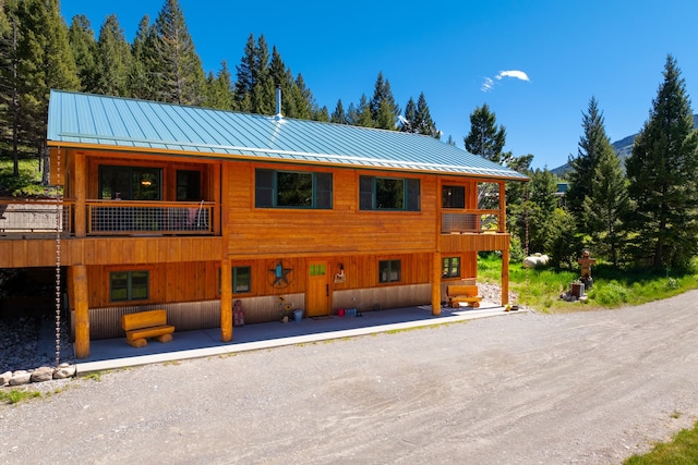 view of front of house featuring a standing seam roof and metal roof