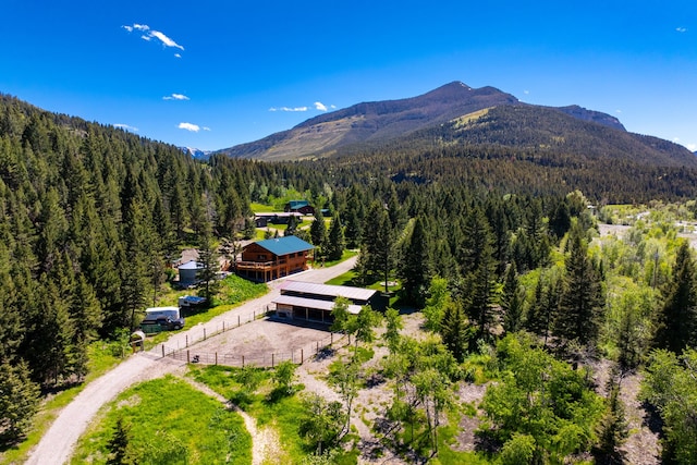 bird's eye view with a forest view and a mountain view