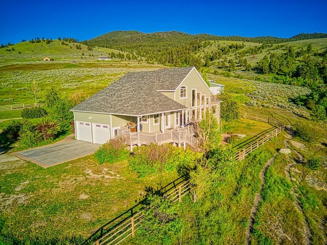 aerial view featuring a rural view and a mountain view