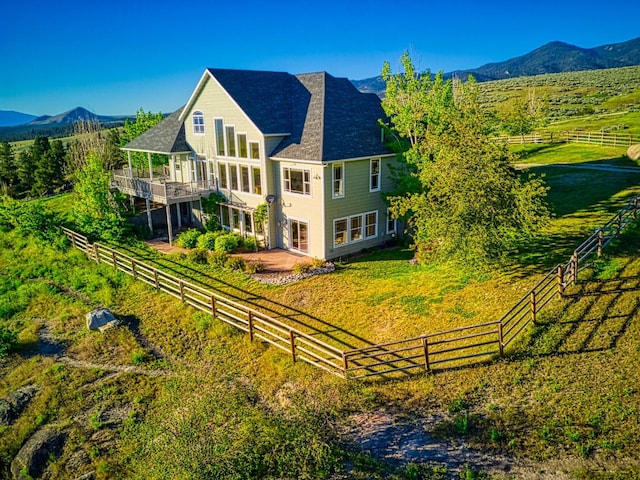 exterior space with a mountain view and a rural view